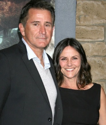 Gia Carides posing with her ex-husband by wearing black dress.